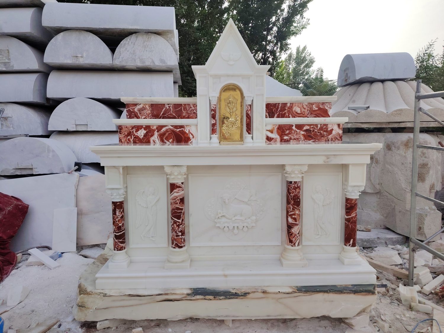 Carved stone church altar in a workshop